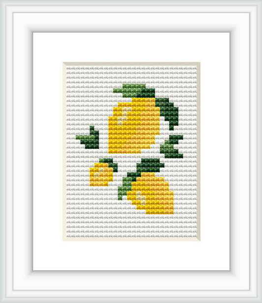 The image contains a framed cross stitch design of small lemon motifs. The lemons are in various sizes and appear against a white background. The stitched area features yellow lemons with green leaves and some gray shading.