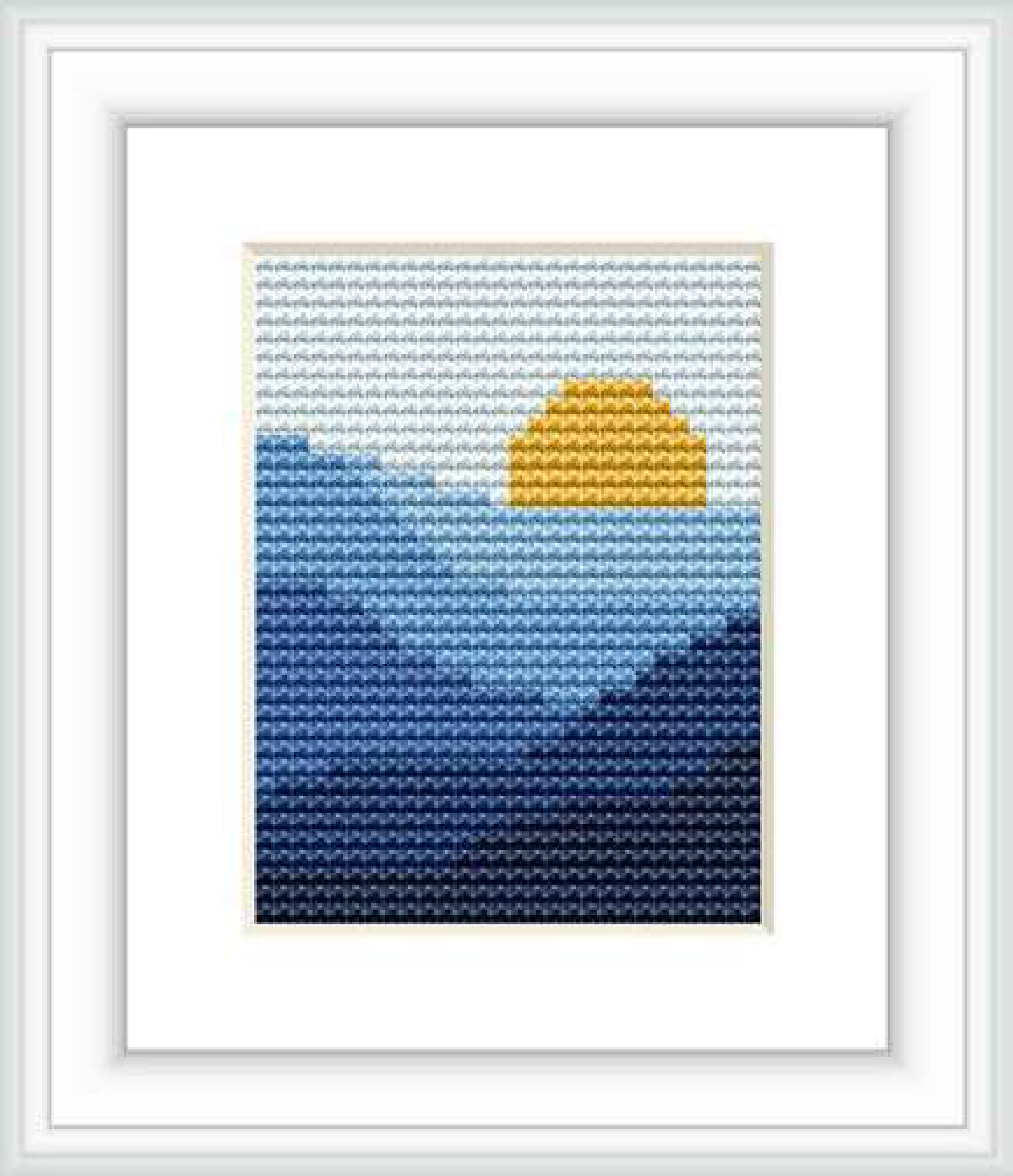The image depicts a cross stitch pattern showcasing an abstract silhouette of a setting sun over the ocean. The pattern utilizes a gradient color scheme, transitioning from light sky blue at the top to deep navy blue toward the bottom, with a yellow sun positioned in the center.