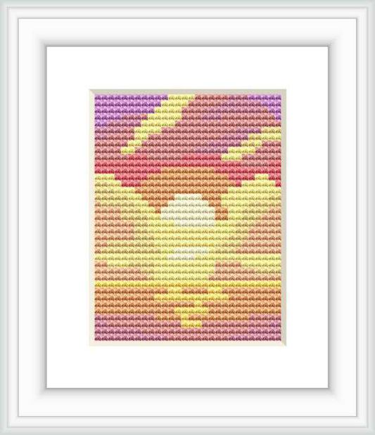 The design features an abstract representation of a sunset with warm colors blending together. It is contained within a small, rectangular cross stitch embroidery format.