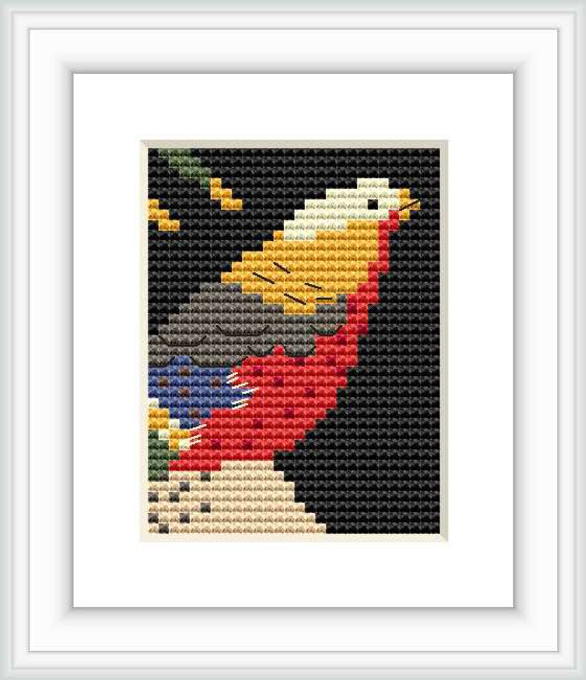 The cross stitch pattern depicts a stylized bird in profile with its beak pointing upwards. It appears amidst dark background with elements of blossoms and leaves. The pattern is framed and presented on a plain background.
