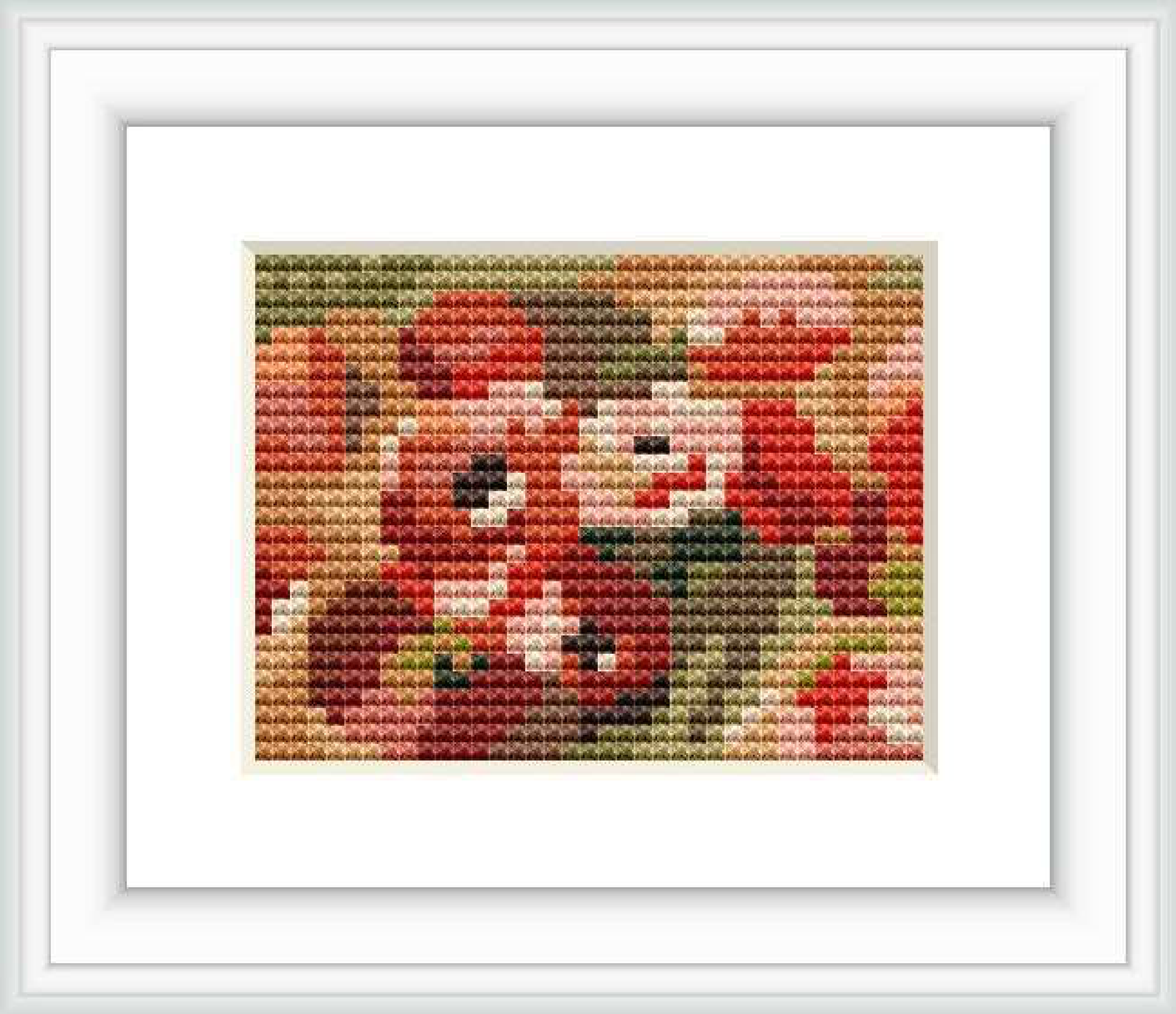 A cross stitch representation of Pierre-Auguste Renoir's artwork featuring anemones. The stitched piece captures the essence of the floral theme with a palette of reds, greens, and neutral tones.