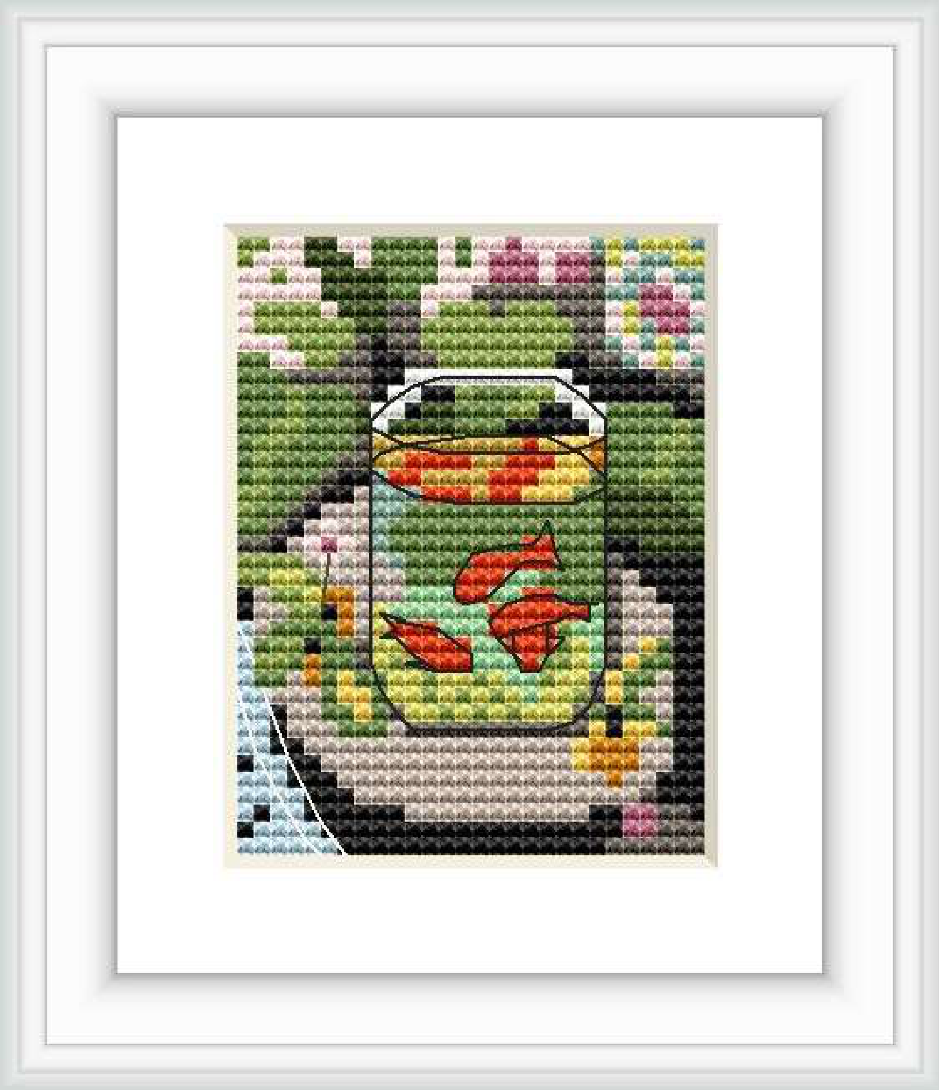 The image depicts a cross stitch pattern of a goldfish bowl with three red goldfish swimming inside. The background has abstract patches of green, representing flora, and other colors that give the impression of a water environment.
