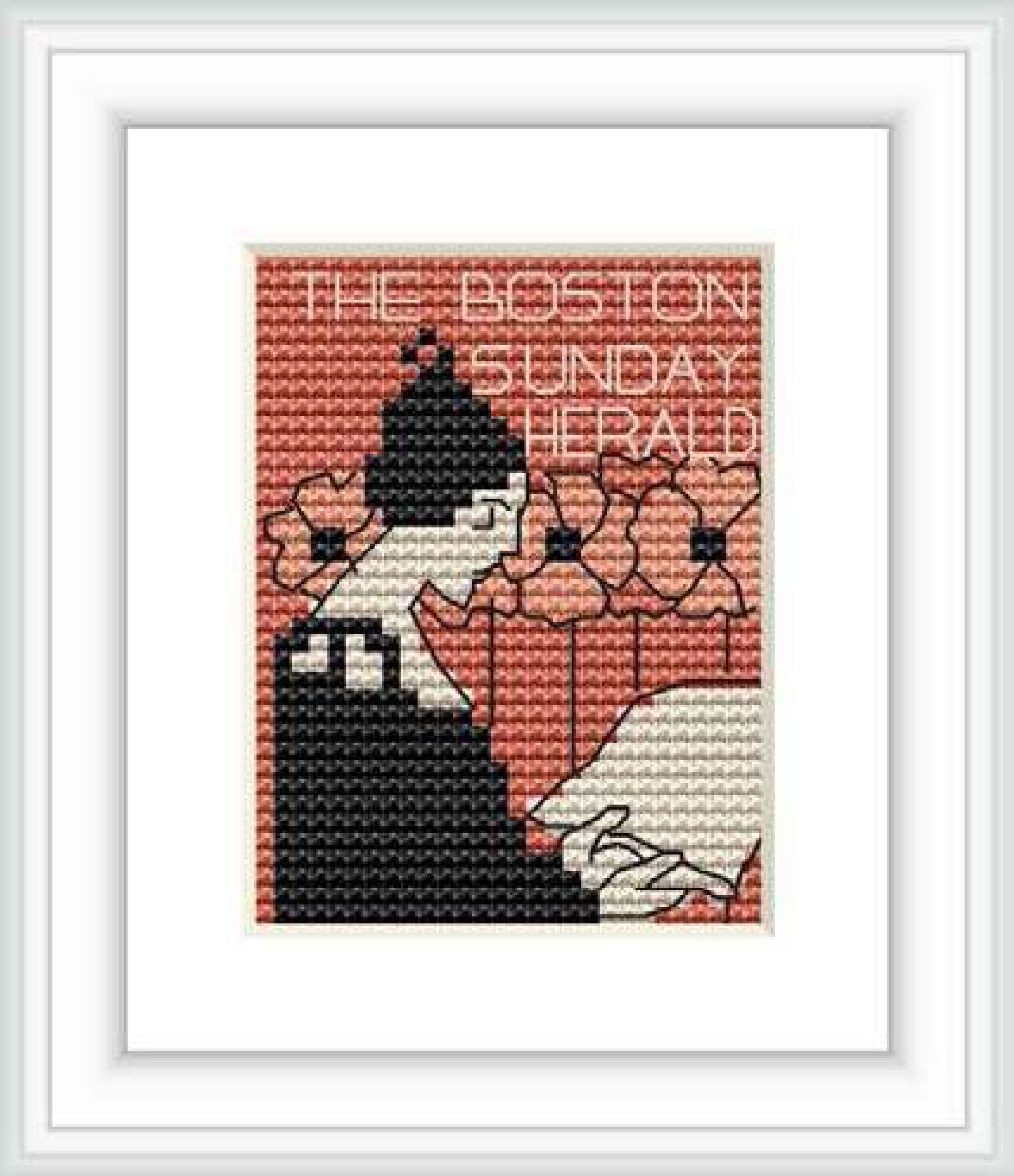 The cross stitch pattern depicts a stylized woman with a hat in a silhouette-like style, reading a newspaper with 'THE BOSTON SUNDAY HERALD' written on it, surrounded by decorative floral elements.