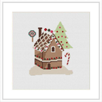 The image shows a cross stitch pattern of a brown cabin with a snow-covered roof. There is a green Christmas tree to the right and a candy cane to the left of the cabin. The background is white, representing snow.