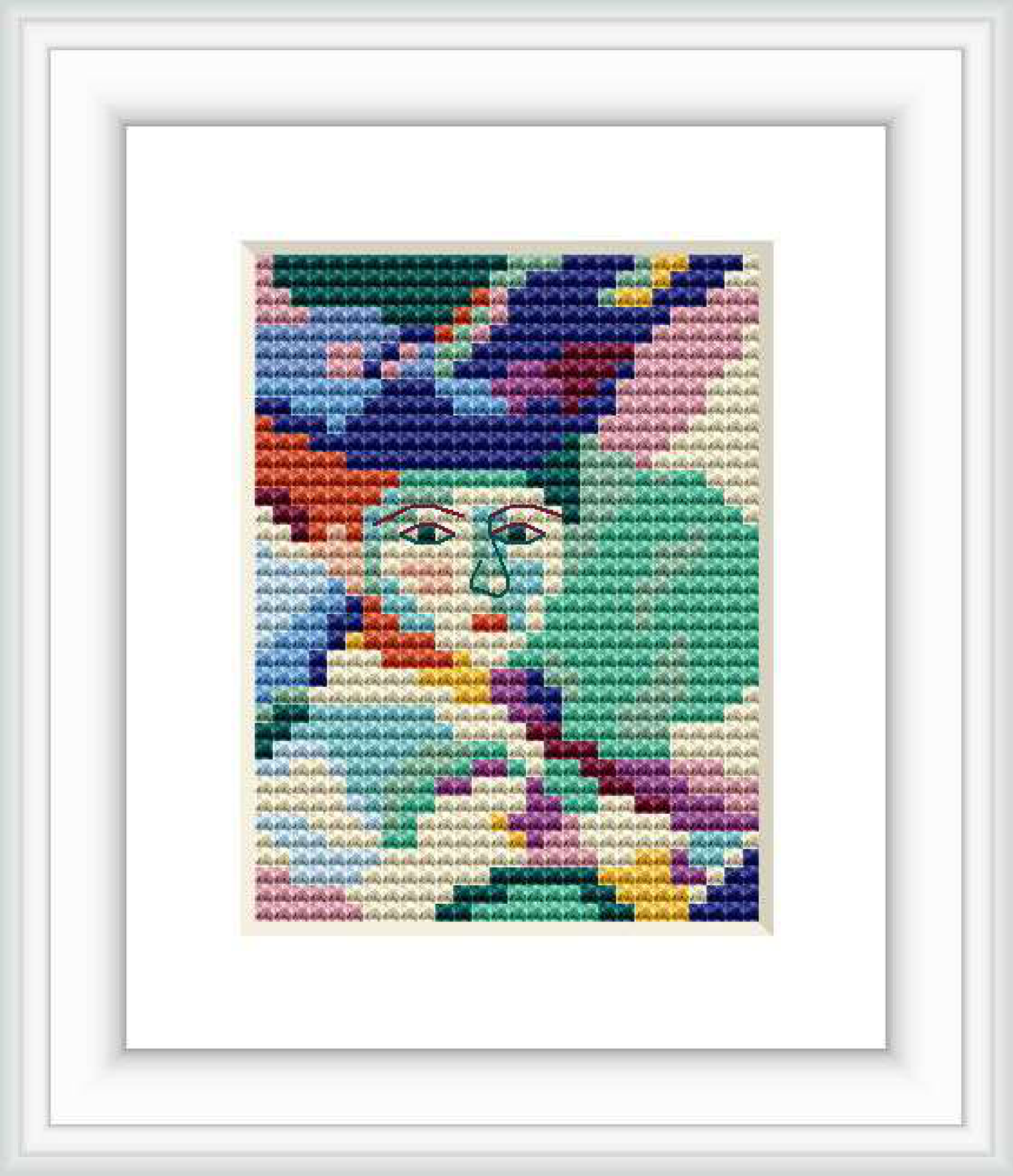 The image depicts a cross-stitch pattern design featuring an abstract portrayal of a woman with a hat. The piece is framed, showing a colorful and geometric interpretation typical of Henri Matisse's style.