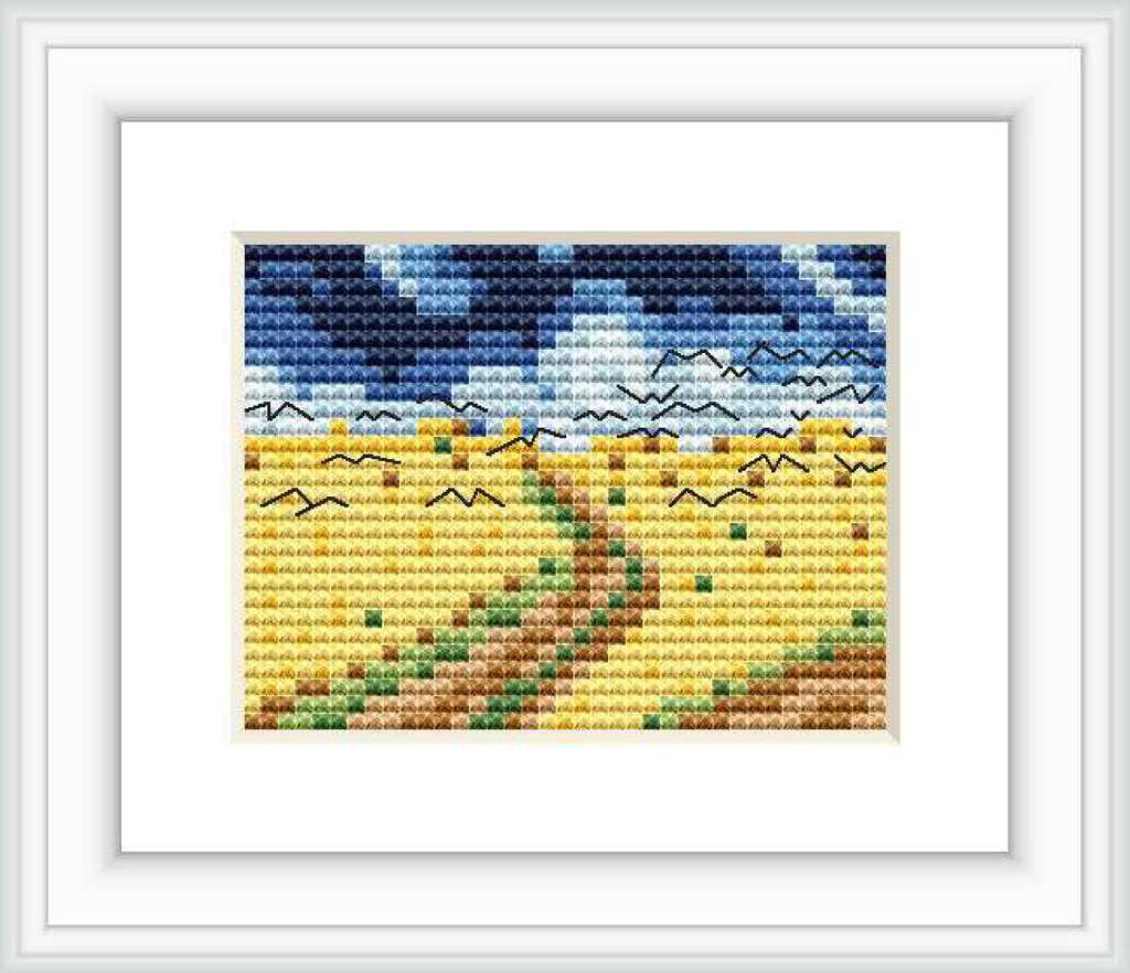 The image depicts a cross stitch pattern that recreates Van Gogh’s Wheatfield with Crows. It features a golden wheat field under a tumultuous sky streaked with blue and white, a pathway through the field, and dark silhouettes of crows flying overhead.