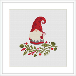 The image showcases a cross stitch pattern with a stylized gnome wearing a tall, curved red hat, positioned above a greenery arrangement with red berry accents, all set against a white background within a square frame.