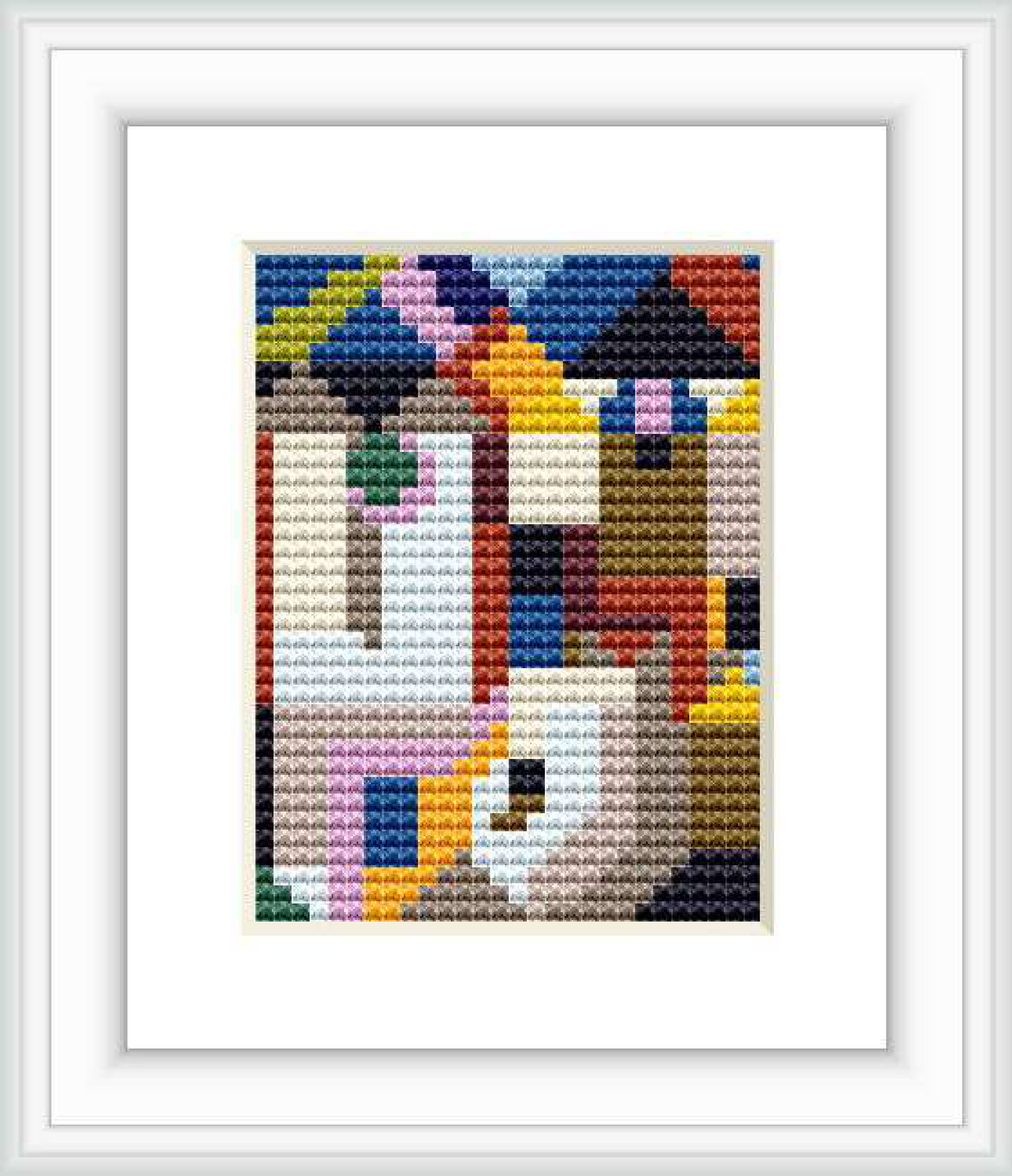 The image features a cross stitch pattern depicting an abstract design with multiple colorful blocks and shapes suggesting a form of architecture.