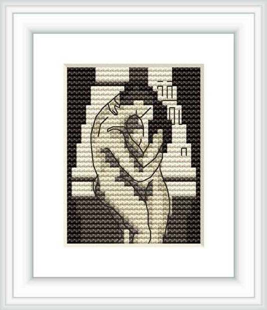 The cross stitch pattern features two abstract figures embracing, with contour lines suggesting their forms, set against a contrasting background.