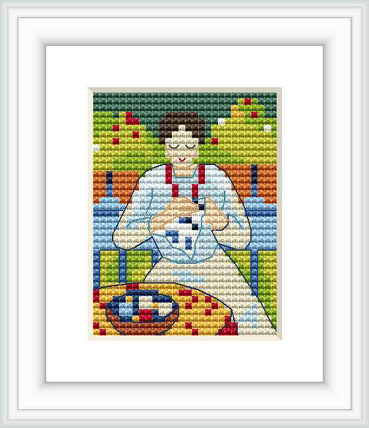 The image showcases a cross-stitch pattern that depicts a woman sitting on a balcony, engaged in the craft of embroidery. The background features an abstract representation of plants and architectural elements.