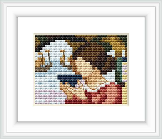 The cross stitch pattern represents a woman gazing into the sea with sailboats in the background, reflecting a mood of contemplation and serenity.