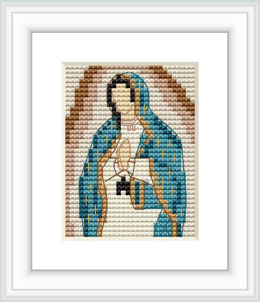 The image displays a pixelated cross stitch pattern of the Virgen de Guadalupe framed in white. The pattern is composed of small, square stitches forming the symbolic figure against a contrasting background.