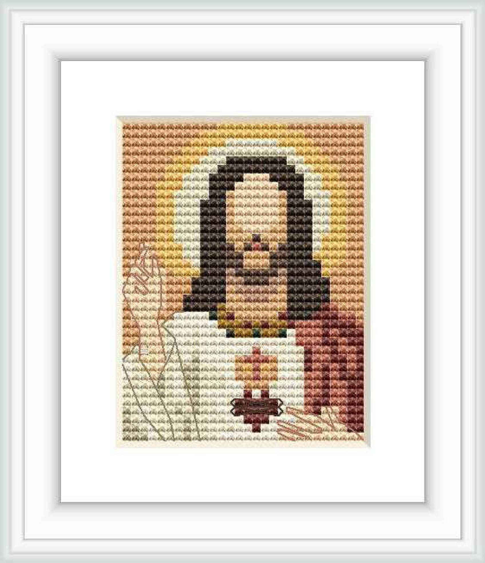 The image depicts a pixelated cross stitch pattern that represents the Sacred Heart of Jesus. It shows a stylized bust of Jesus with a golden heart in the center surrounded by flames. The pattern is small and framed, set against a solid beige background.