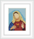 The image shows a cross stitch representation of the Virgin Mary, centered on a canvas with a blue background at the top and a neutral tone at the bottom. She's depicted with a red garment and a symbolic heart on her chest.