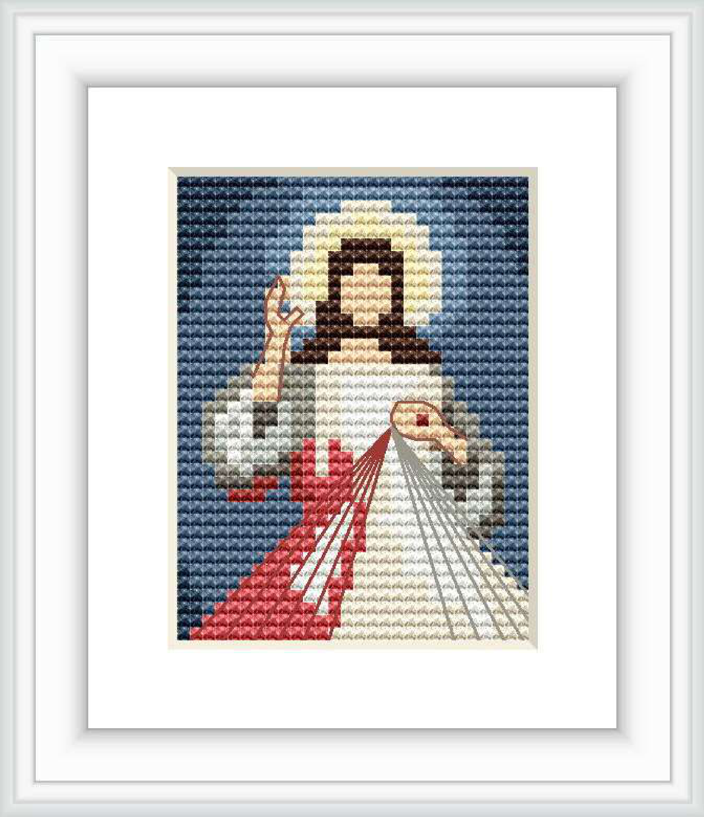 The image features a cross stitch pattern depicting the Divine Mercy, with Jesus Christ raising his right hand in blessing, and his left hand touching his chest with rays of white and red light emanating from his heart, set against a dark blue background.