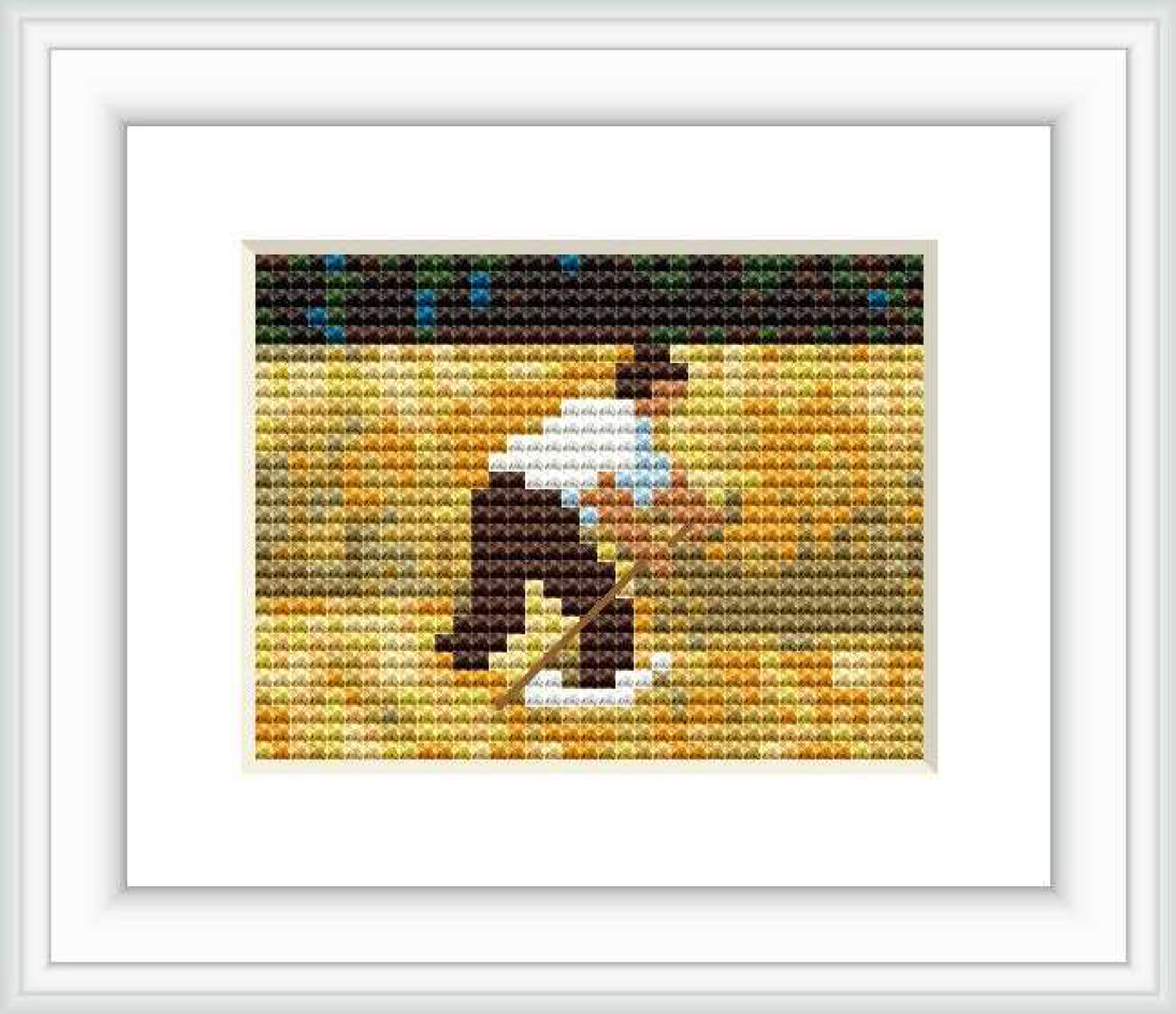 The cross stitch pattern depicts a figure mowing a field, surrounded by a lush green landscape with splashes of browns and yellows, representing the rustic charm of the countryside.