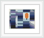 The image shows a framed cross stitch pattern consisting of blocks of color forming a pixelated design, with a dominant central orange block resembling a leaf surrounded by a background of various shades of blue, purple, white, and gray.