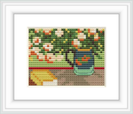 The cross stitch pattern displays a vase filled with oleanders atop a pile of books. The background suggests a tapestry or a wall with varying hues of green and splashes of red and white, created in a style evocative of Vincent Van Gogh's brushwork.