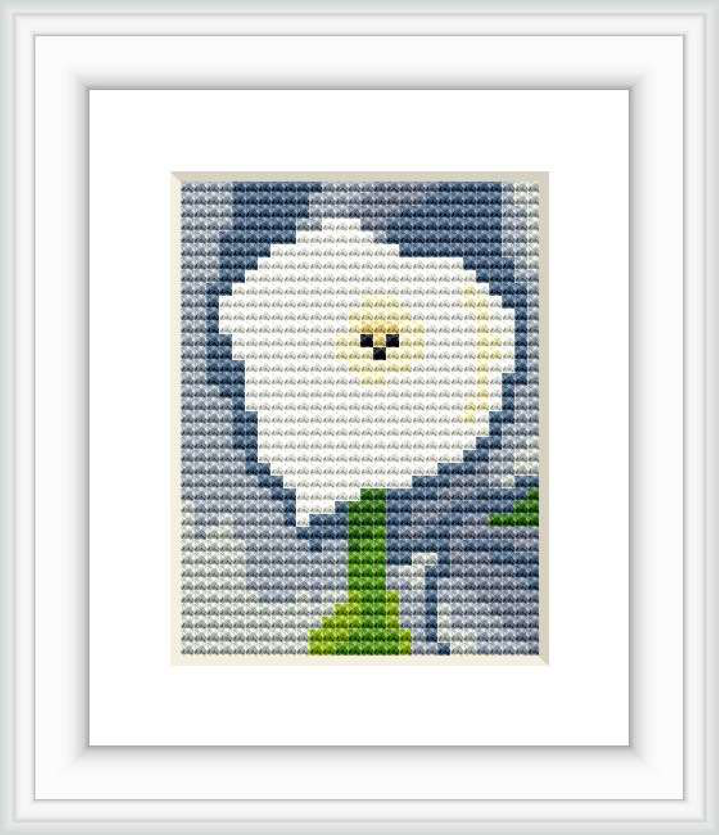 A cross stitch pattern depicting a single calla lily flower with a yellow center against a grey background, contained within a squared frame.