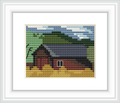 The image depicts a small shanty or cabin with a dark roof next to a lake, surrounded by green foliage, under a blue and cloudy sky. The shanty has a red window, and the impression of a serene landscape is given.