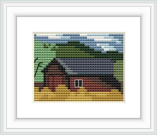 The image depicts a small shanty or cabin with a dark roof next to a lake, surrounded by green foliage, under a blue and cloudy sky. The shanty has a red window, and the impression of a serene landscape is given.