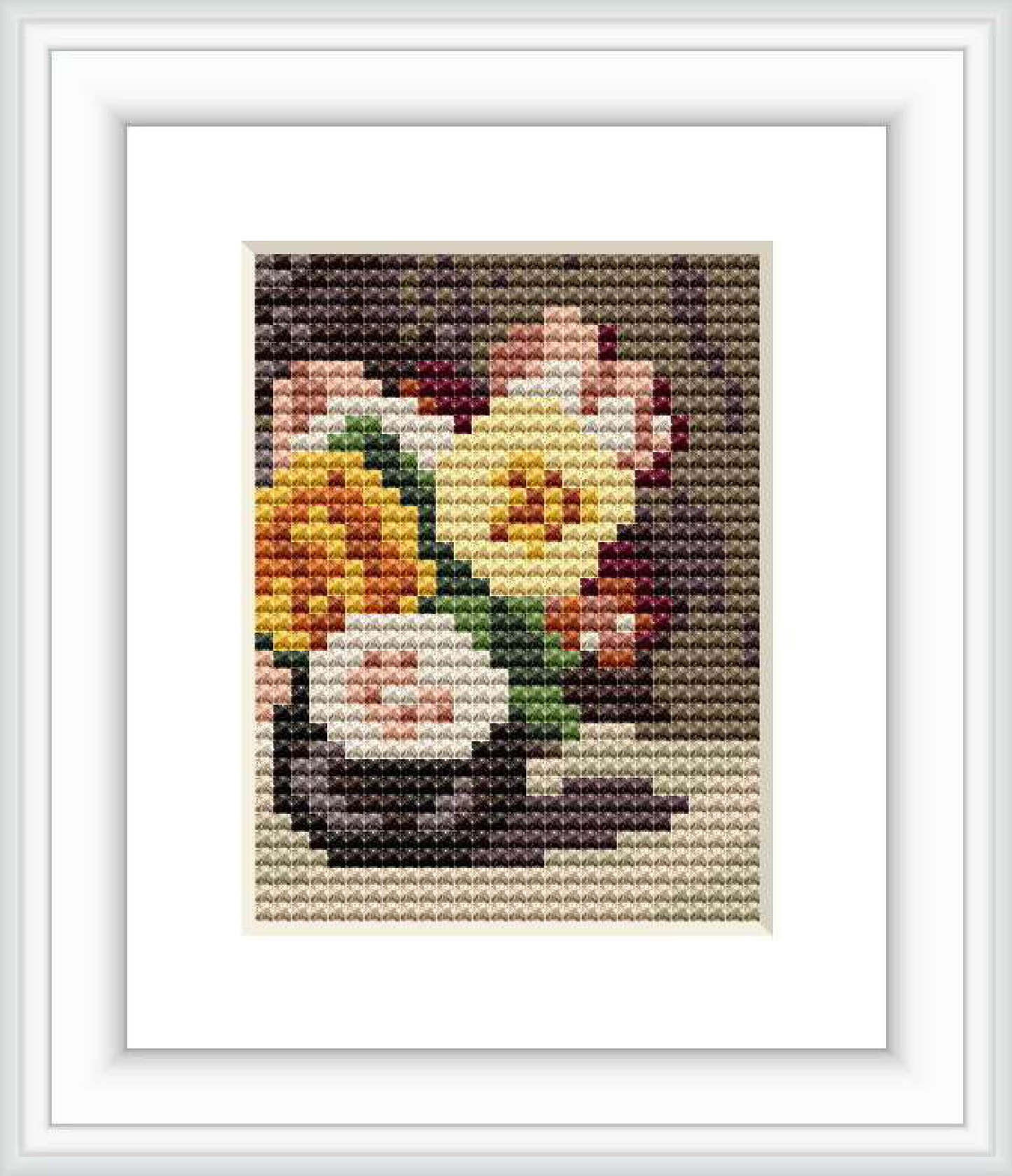 A framed cross stitch pattern depicting a bouquet of roses with a blend of pastel colors, primarily yellow and pink, against a dark background, contained within a white square frame.