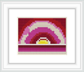 The image shows a framed cross stitch pattern that depicts an abstract sunrise with layered colors fading from dark purple to bright yellow at the center.
