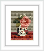 The image depicts a cross stitch pattern featuring a bouquet of pink roses and blue forget-me-nots placed in a vase, with subtle shades of green and brown in the background.
