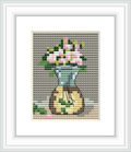 The image depicts a cross stitch pattern featuring a vase with blooming roses. The surface on which the vase rests is partially visible, and the background consists of a textured gray fabric.