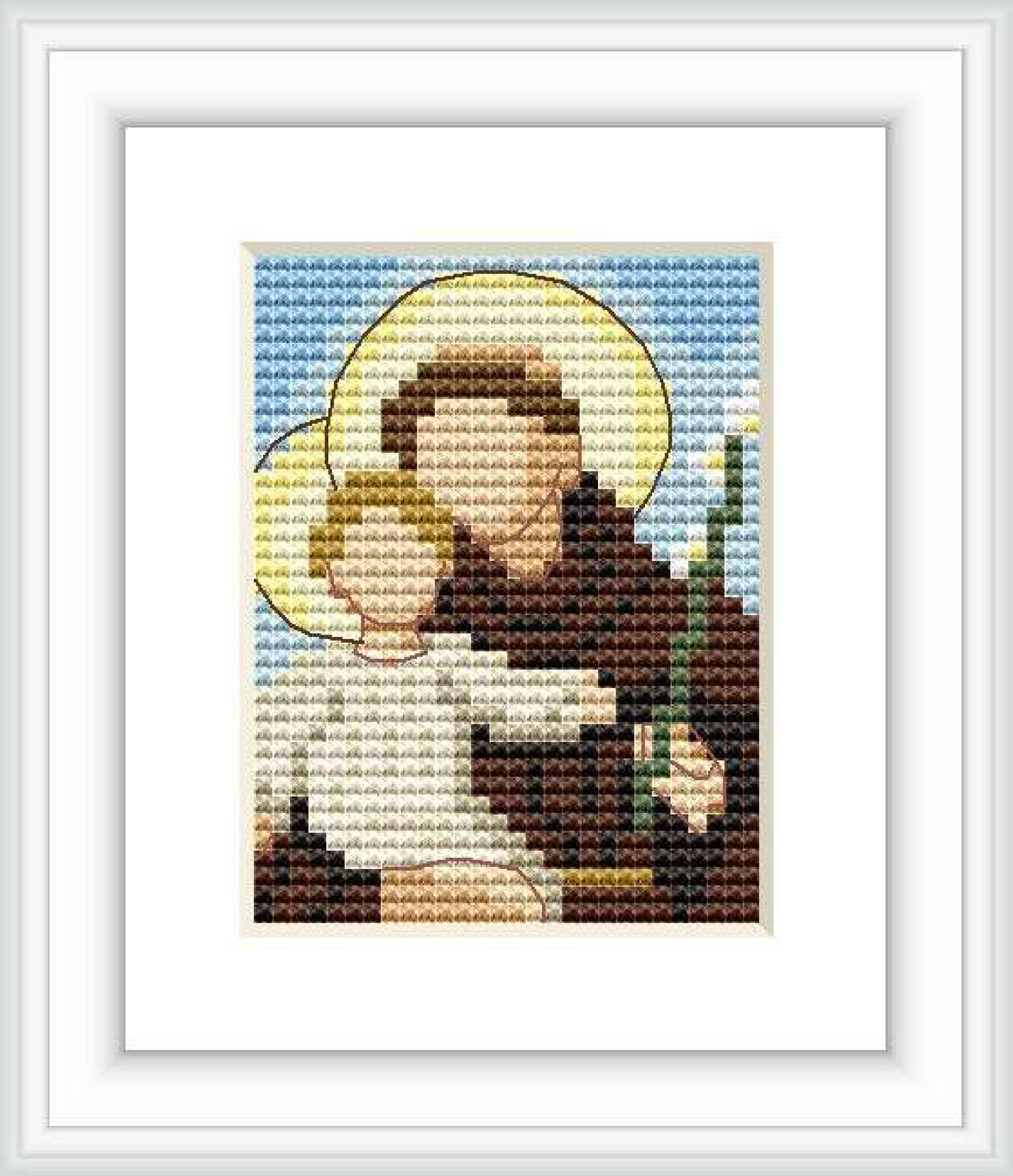 The image depicts a cross stitch pattern of Saint Antonio holding a child, surrounded by a golden halo. The background consists of a sky blue gradient, suggesting a serene atmosphere.