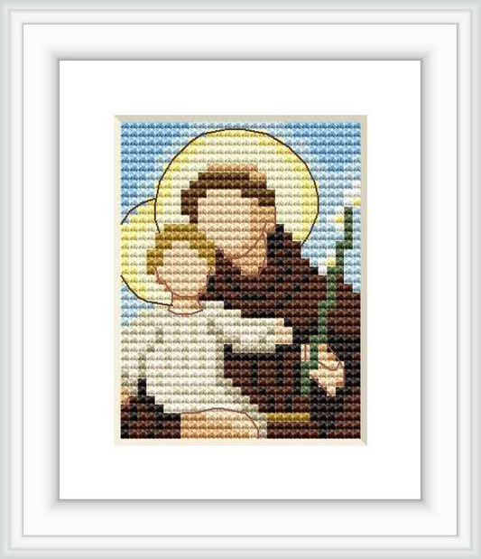 The image depicts a cross stitch pattern of Saint Antonio holding a child, surrounded by a golden halo. The background consists of a sky blue gradient, suggesting a serene atmosphere.