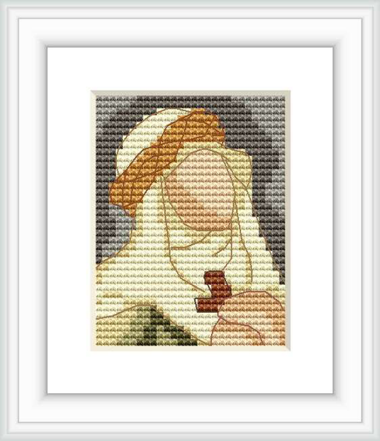 The image depicts a cross stitch pattern framed and displayed against a white background. The pattern shows a figure in contemplation, with earthy and muted color tones.