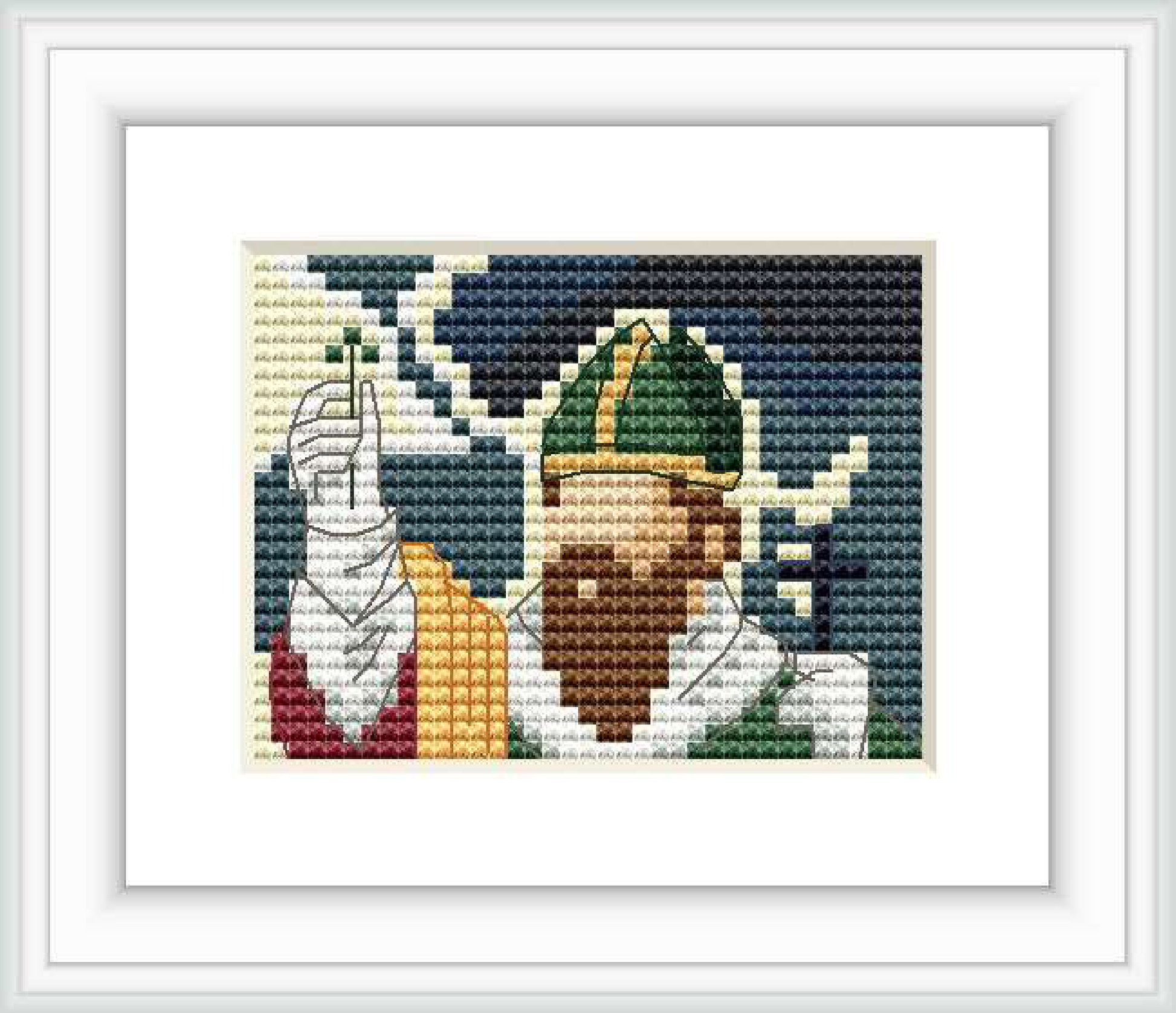 The image displays a framed cross stitch pattern depicting a bearded figure wearing a green hat with a dark green band and a yellow and red outfit.