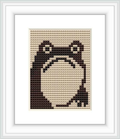 The image depicts a cross stitch pattern of a stylized frog with a simplified design, prominently featuring shades of brown against a light background, framed within a square border.