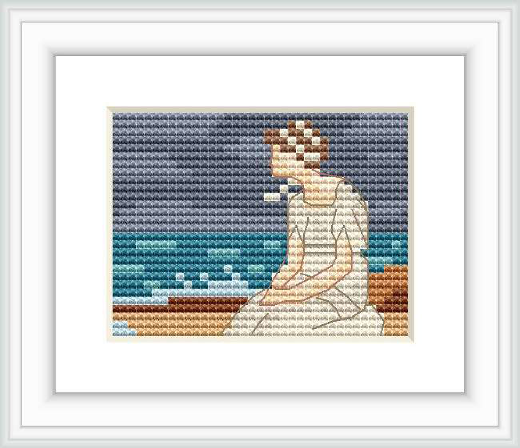The cross stitch pattern depicts a female figure sitting by the sea, the horizon visible in the background with soft waves, under a gradient sky from dark to light blue tones.