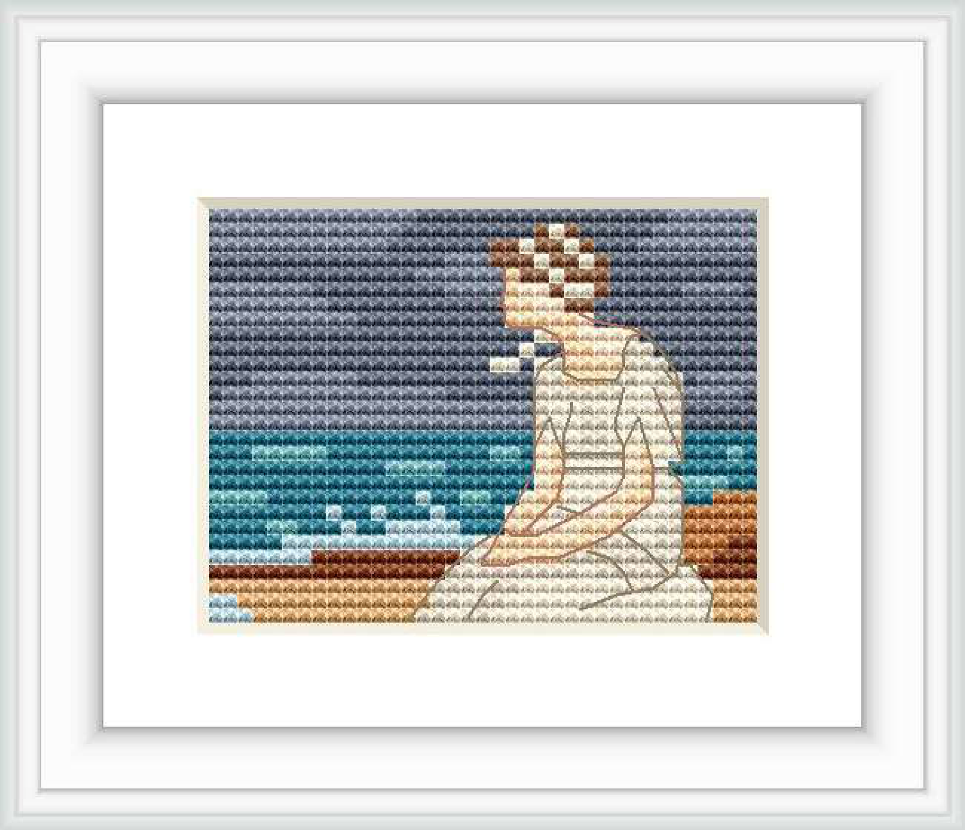 The cross stitch pattern depicts a female figure sitting by the sea, the horizon visible in the background with soft waves, under a gradient sky from dark to light blue tones.