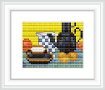 The cross stitch pattern depicts a still life scene with a blue enamel coffeepot, accompanied by other kitchen items such as a teapot and cups, arranged against a backdrop with a blend of vivid colors creating a checkerboard effect.