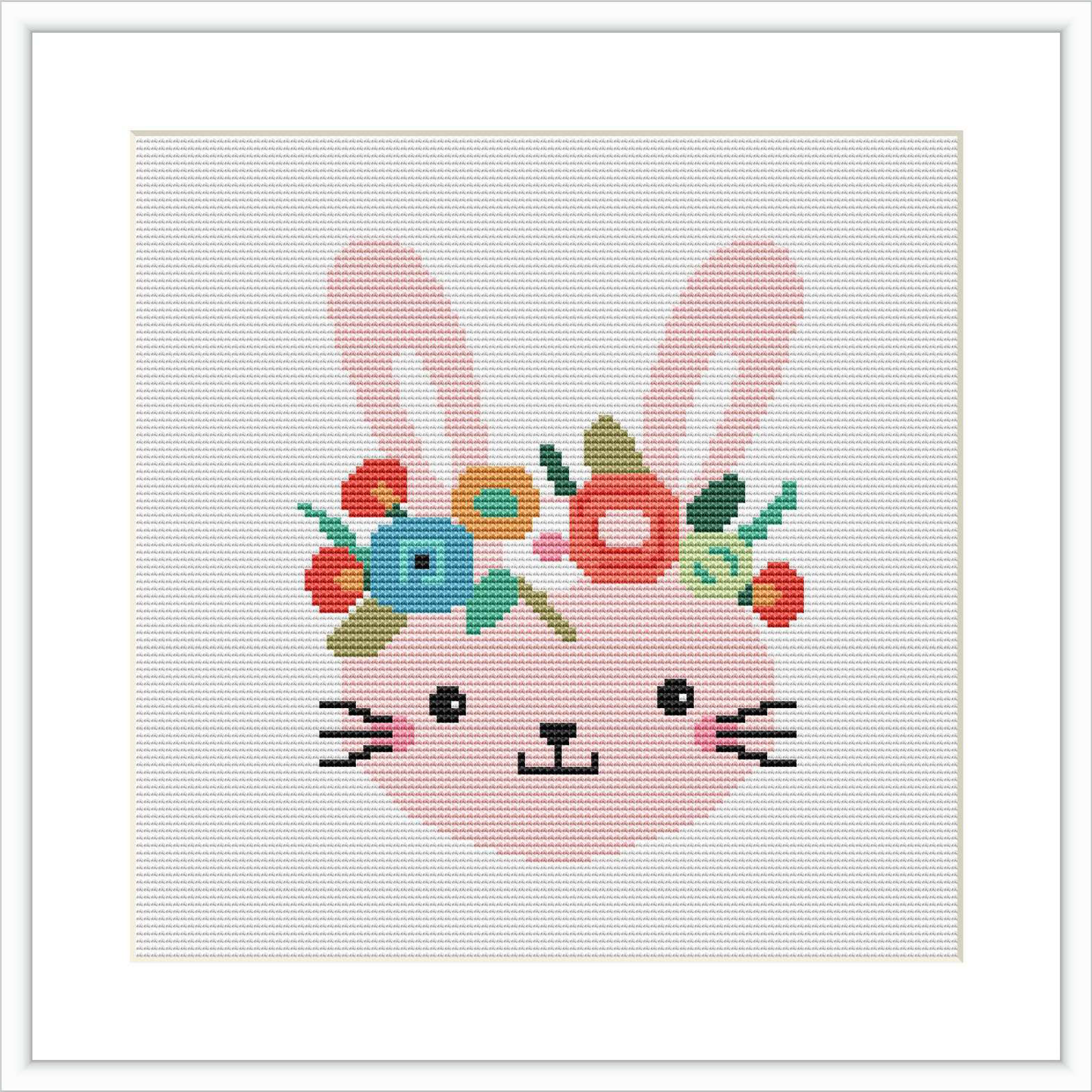 The image depicts a cross stitch pattern showing a stylized pink bunny with flowers and leaves on its head. The bunny has a cheerful expression with its eyes closed and mouth in a content smile. The embroidery is set within a square grid, framed by a simple white border.