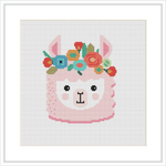 This image depicts a framed cross stitch pattern of a pink llama with a floral crown on its head. The background is white, and the pattern is centered within the frame.