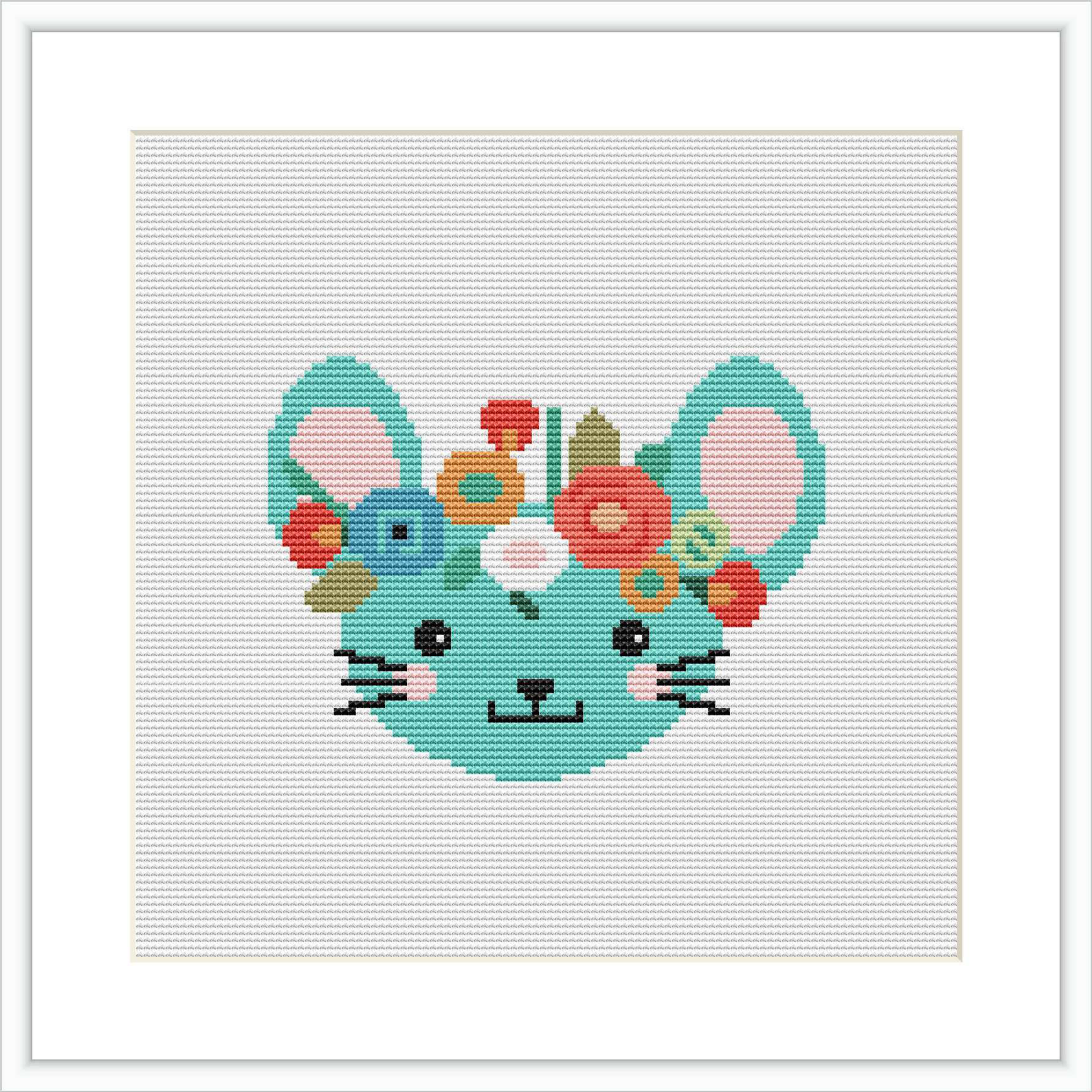 The image depicts a cross stitch pattern of a stylized mouse's face in pastel blue with floral decorations on its head. The mouse features tiny black whiskers, a pink nose, and two beady eyes. It is centered on a grid canvas, framed by a simple white border.