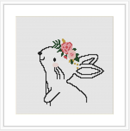 The image shows a cross stitch pattern of a bunny with wings and a floral crown on its head, displayed against a plain white background.