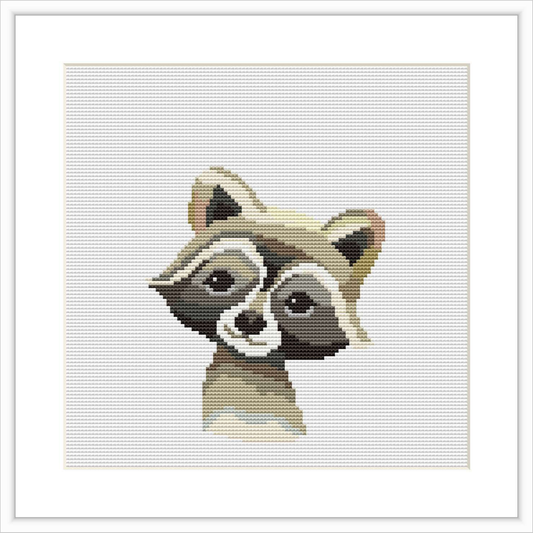 The image features a stylized raccoon head portrayed in a watercolor cross stitch pattern. It is centered on a white canvas-like background within a framed area measuring 7 inches square.