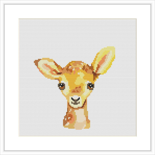 The image showcases a cross stitch pattern of a baby deer head with a friendly expression. The pattern presents a watercolor-like appearance, with a combination of warm tones against a white background. It's centered on the canvas and the stitching is grid-like to form the complete image of the deer.