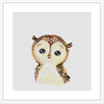 The image depicts a cross stitch pattern of a baby owl with big eyes and a small beak. It is centered on a grid-like fabric, with a clean, white border around the stitched area.