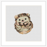 The image displays a cross stitch pattern of a baby porcupine. It is centered in the frame, surrounded by a white border on a white fabric background.