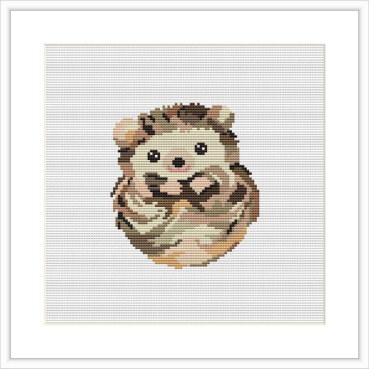 The image displays a cross stitch pattern of a baby porcupine. It is centered in the frame, surrounded by a white border on a white fabric background.