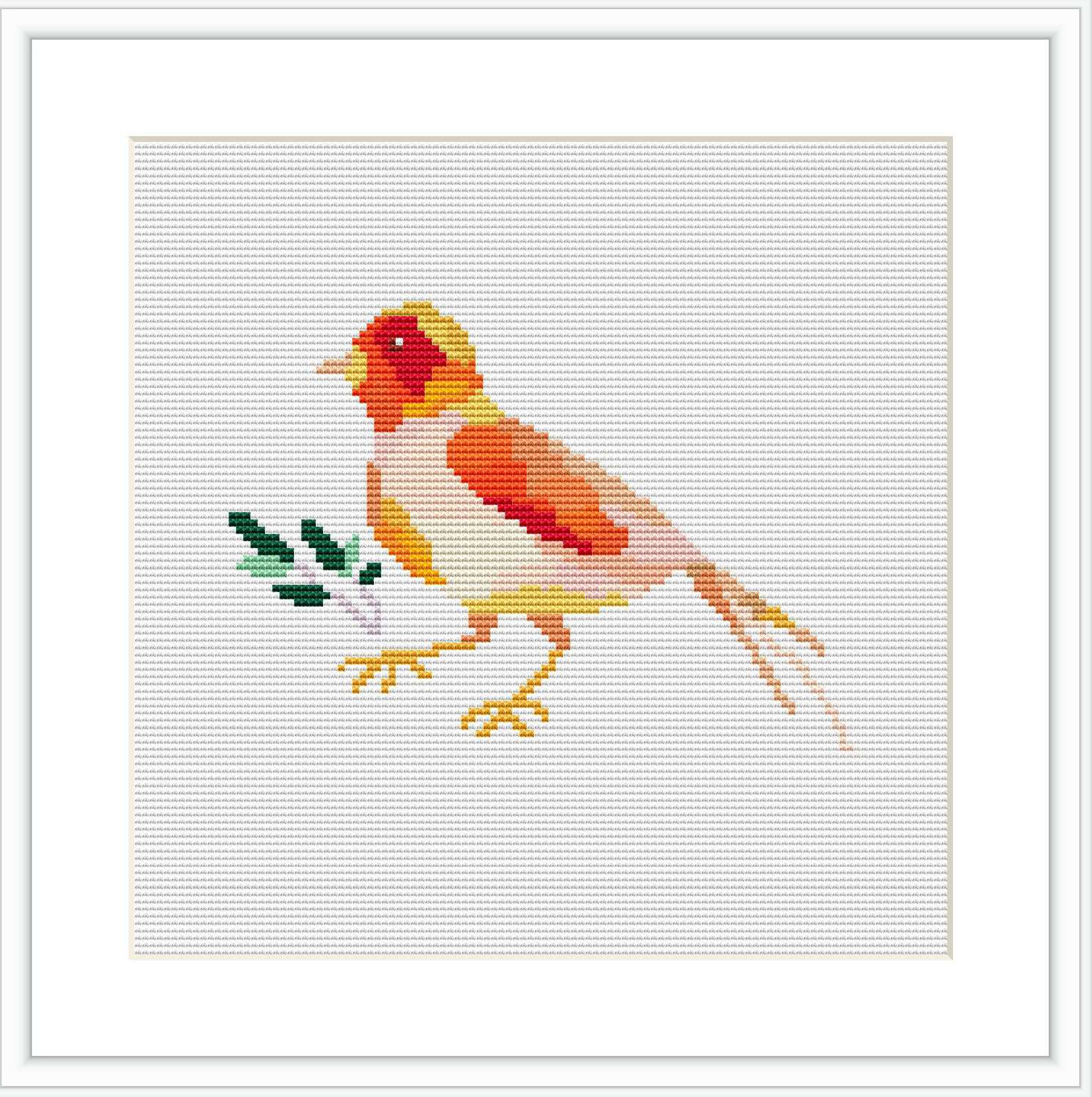 The image displays a cross stitch pattern of a stylized bird in warm tones of orange, red, and yellow with green details on a branch, all set against a white background.