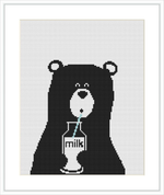 The image features a pixelated, front-facing portrait of a cute bear with a serene expression, holding a glass of milk with a mint straw in it.