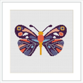 The image depicts a framed cross stitch pattern of a butterfly centered on a white canvas, with vibrant colors and symmetrical patterns on each wing.