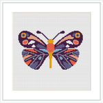 The image depicts a framed cross stitch pattern of a butterfly centered on a white canvas, with vibrant colors and symmetrical patterns on each wing.